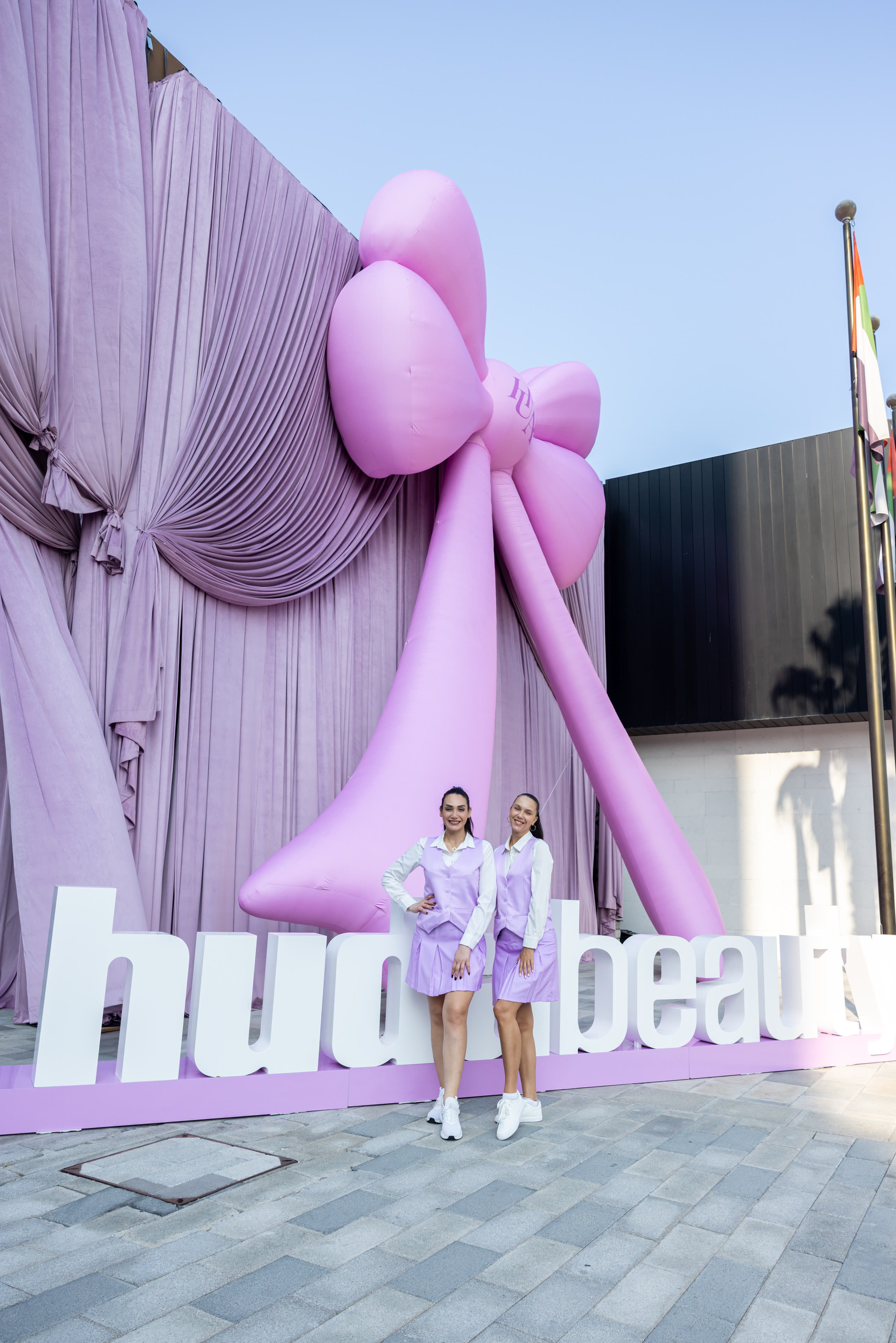 Huda Beauty’s Giant Inflatable Bow: Designing to Be Photographed